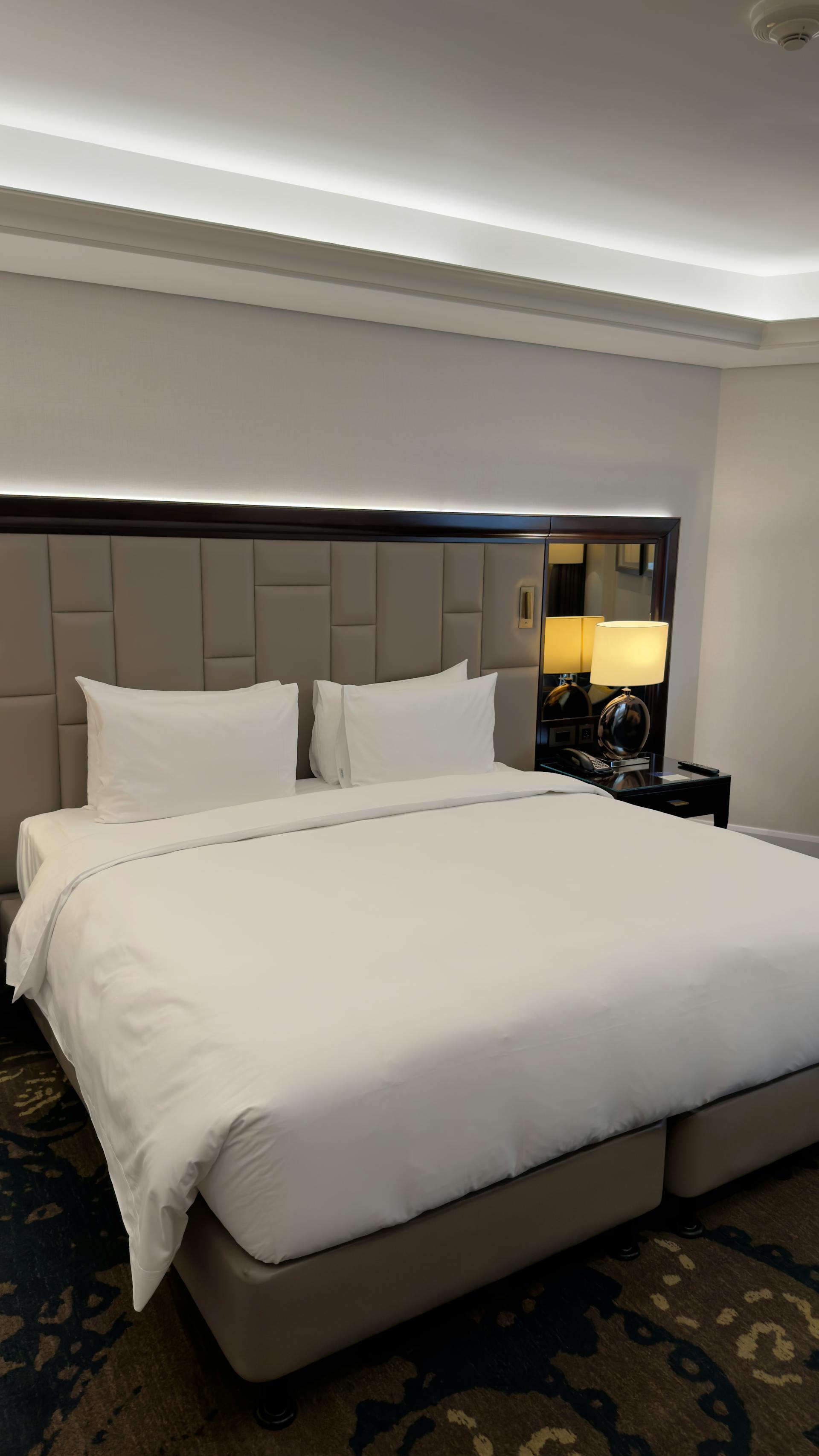 Hotel suite with hospitality-grade bed linens — WashMe commercial contracts