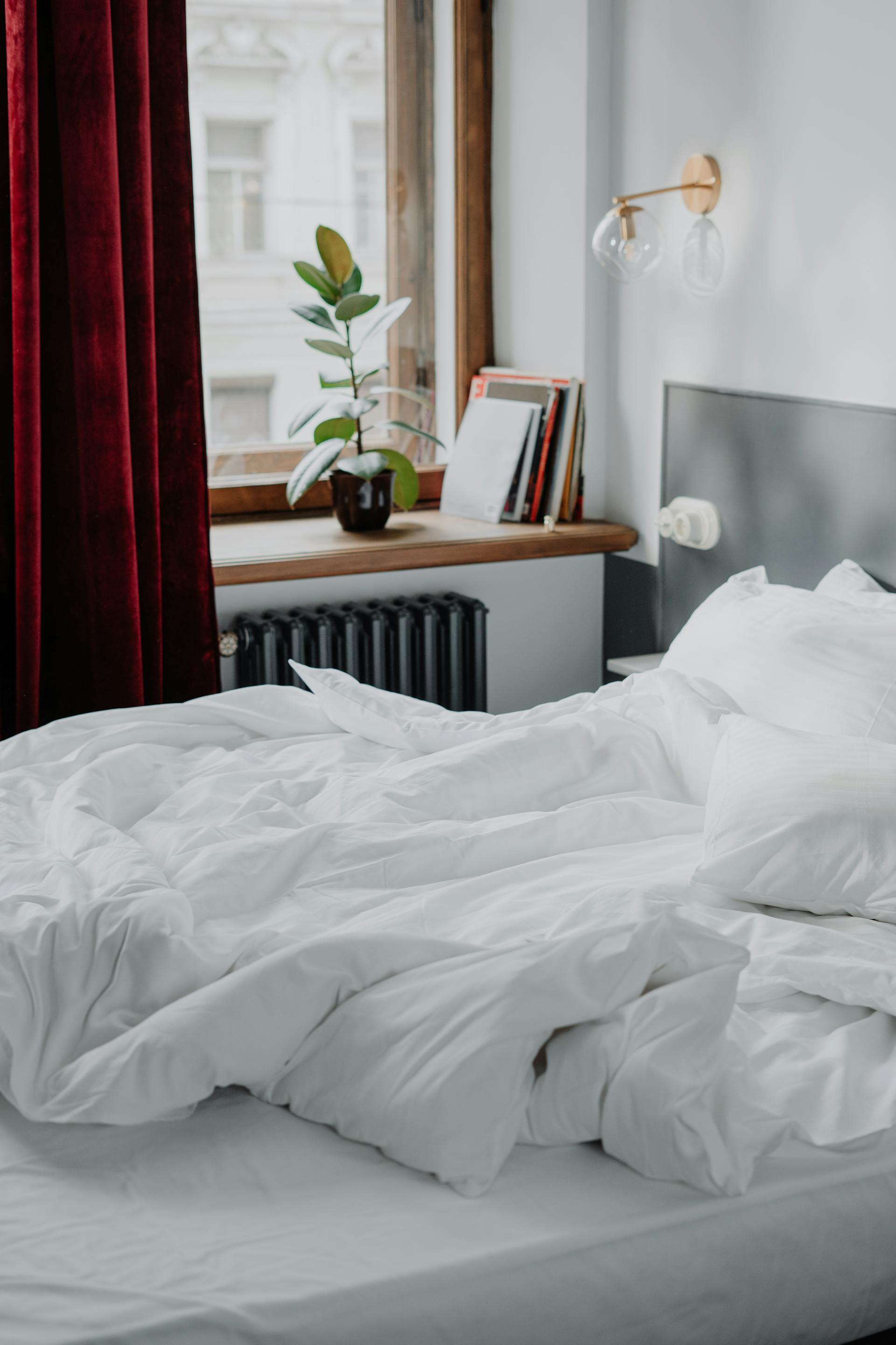 Bright Airbnb bedroom with crisp white turned linens